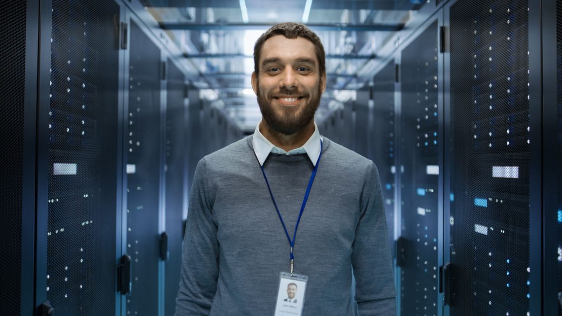 Engineer with badge on site at a large data center