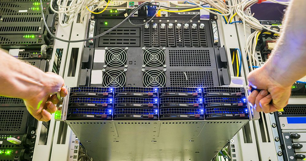Hands shown pulling server out of rack