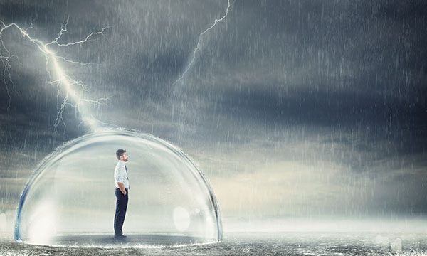 Man in protective bubble while it rains and lightning strikes