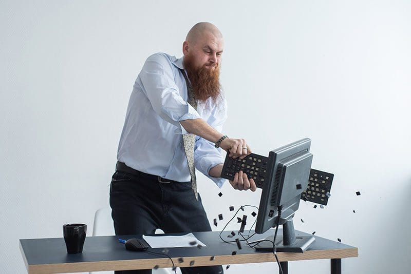 Man smashing his computer