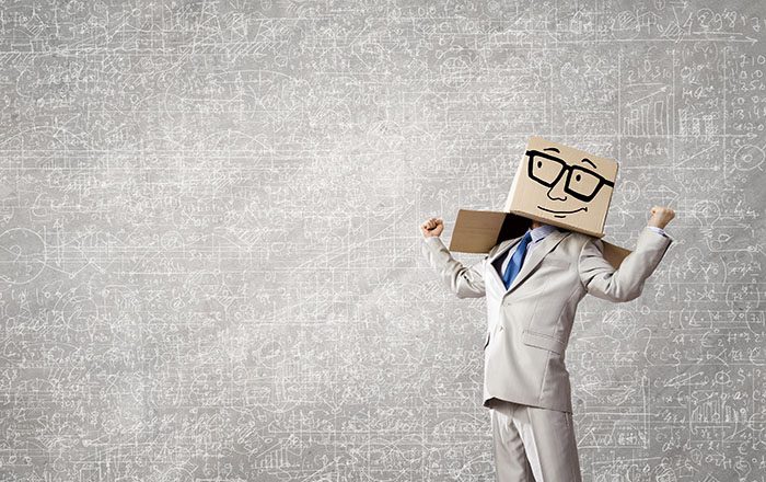 Businessman with box over his head with smiling face