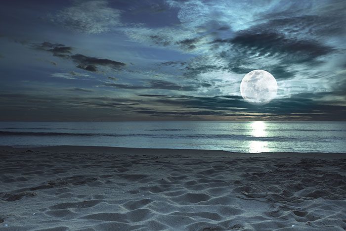 Moon viewed from ocean beach