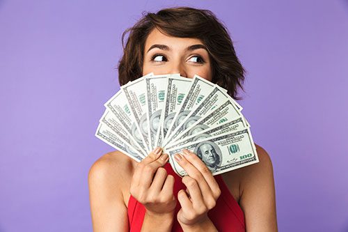 Woman holding a fan of money